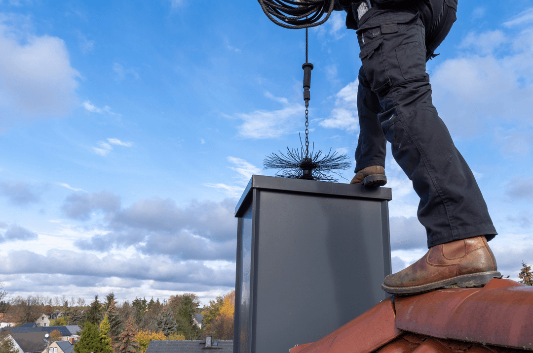 men sweeping chimney