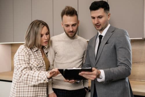 Real estate broker with his clients