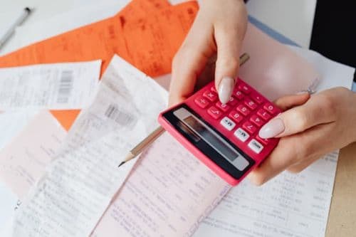 Person calculating the costs the seller has already paid