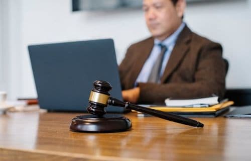 Notary with a judge's gavel on his desk