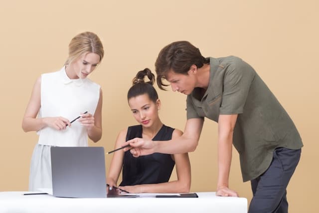 People looking at a computer